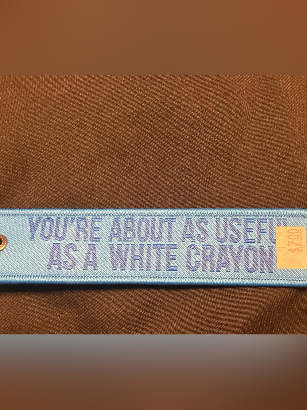 'You’re About As Useful As A White Crayon' keychain